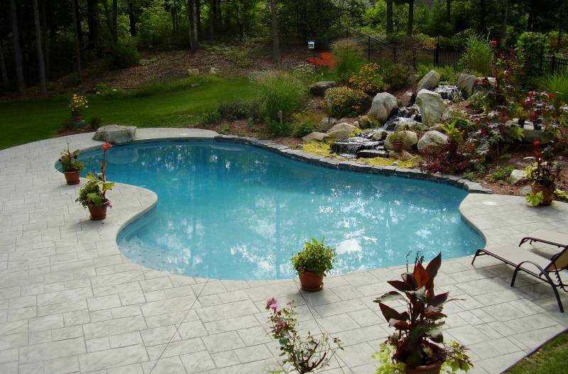 Kidney-shaped pool with waterfall